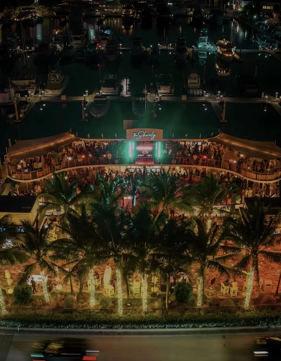 The Shorely from above at night, docked at Marina Village